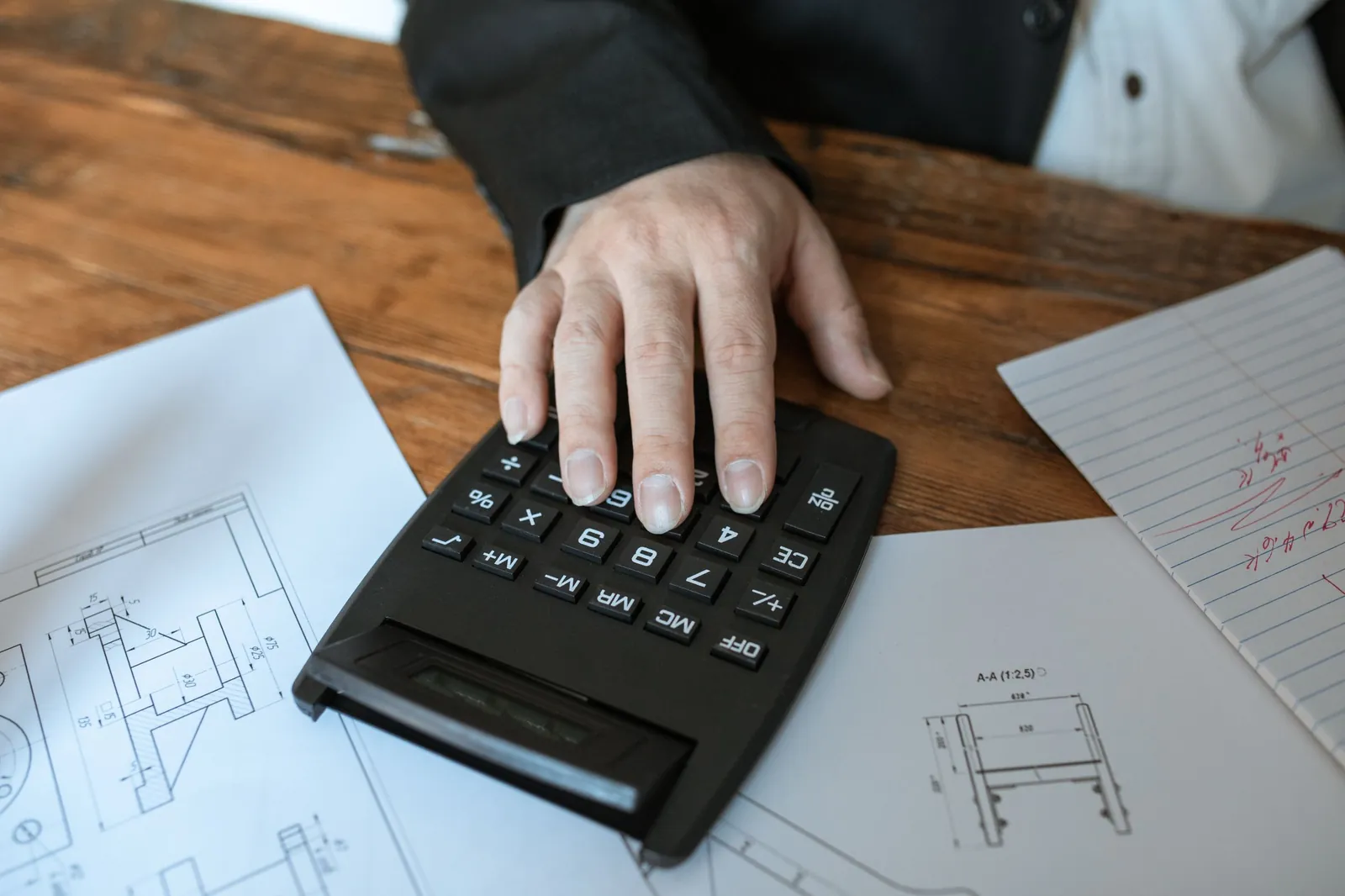 Calculator on top of technical drawings