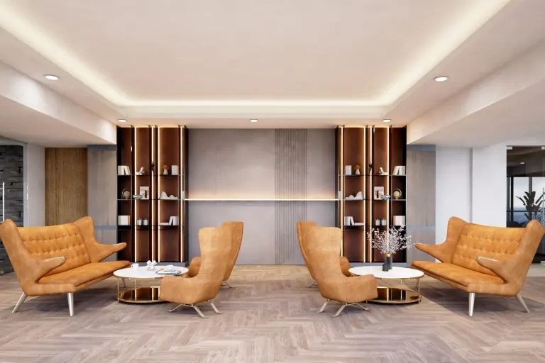 Lounge with orange armchairs and timber shelving